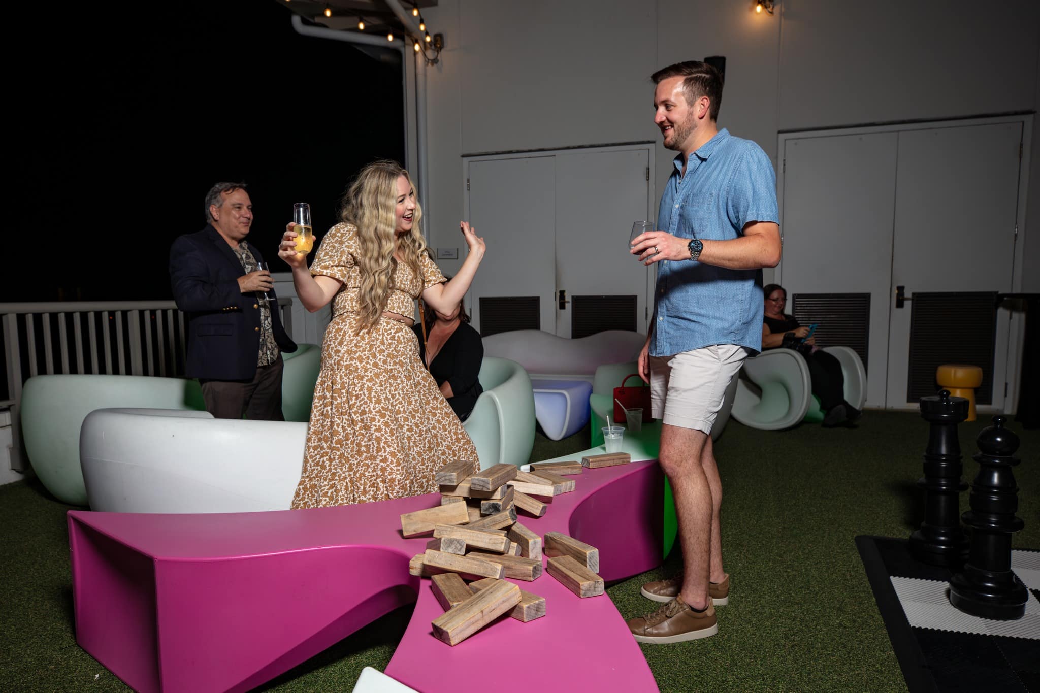 a man and a woman standing in front of a cake