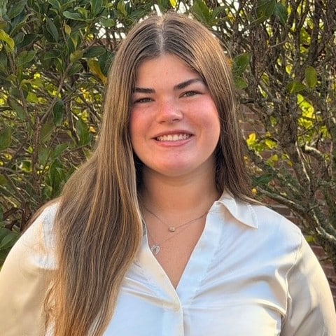 a person smiling for the camera